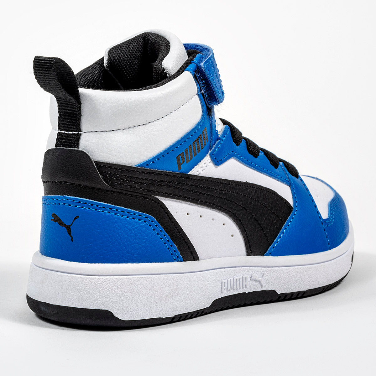 Tenis Puma Rebound v6 Mid AC + PS  para Niño marca Puma Blanco cod. 123353