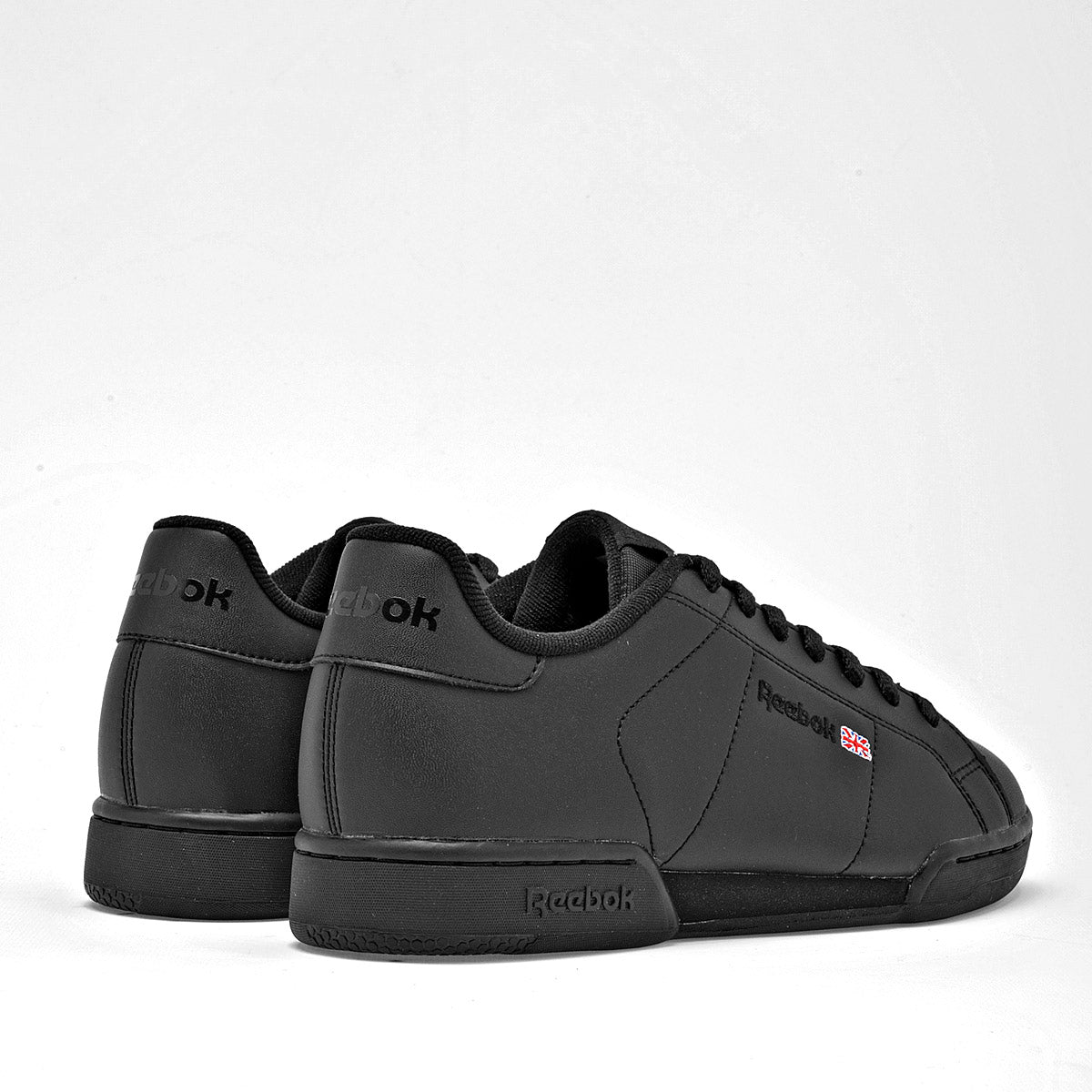 Pakar.com | Tienda online - Tenis modelo NPC II Syn para joven marca Reebok Negro cod. 68349